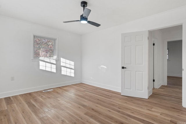 spare room with ceiling fan and light hardwood / wood-style flooring