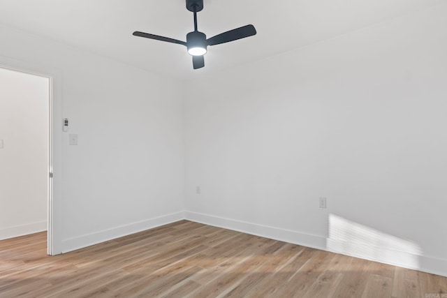 empty room with ceiling fan and light wood-type flooring