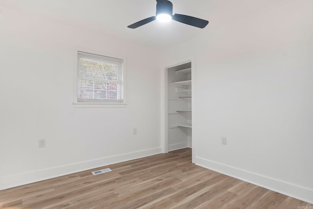 unfurnished room with light hardwood / wood-style flooring and ceiling fan