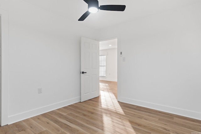 unfurnished room featuring ceiling fan and light wood-type flooring