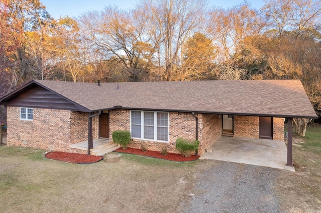 ranch-style house featuring a carport