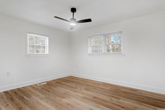 spare room with ceiling fan and light hardwood / wood-style flooring