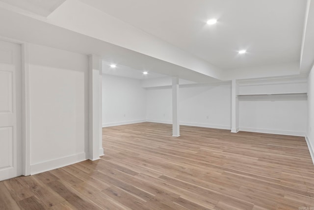 basement featuring light hardwood / wood-style flooring