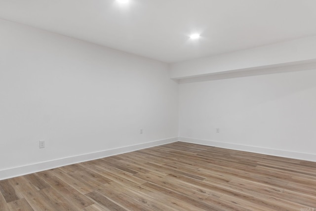 spare room featuring light hardwood / wood-style flooring