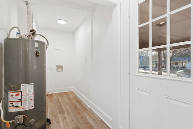 utility room featuring gas water heater