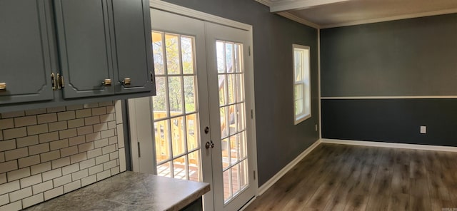 entryway featuring tile walls, ornamental molding, dark wood-type flooring, and french doors