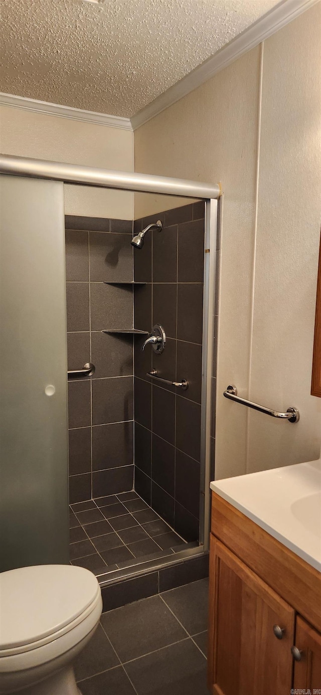 bathroom with tile patterned flooring, a tile shower, and toilet