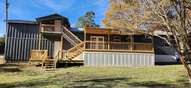 rear view of property with a yard