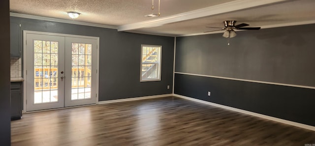 spare room featuring french doors, dark hardwood / wood-style floors, and ornamental molding