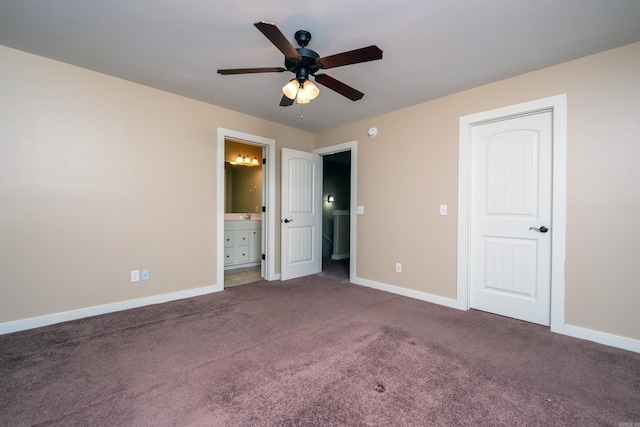 unfurnished bedroom featuring carpet floors, ensuite bath, and ceiling fan