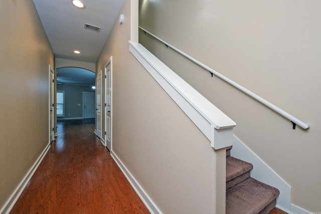 hallway with dark hardwood / wood-style floors