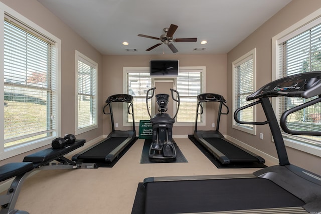 exercise area with carpet floors and ceiling fan