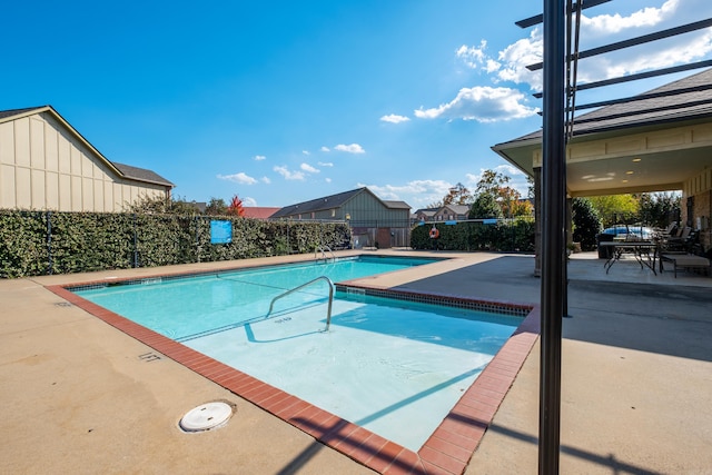 view of swimming pool featuring a patio area