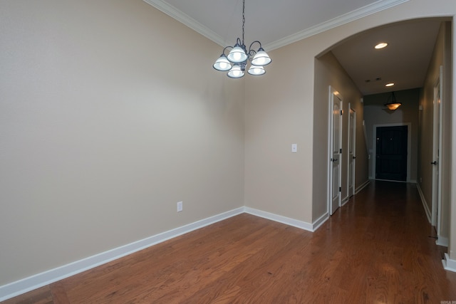 interior space featuring crown molding, dark wood-type flooring, and a notable chandelier