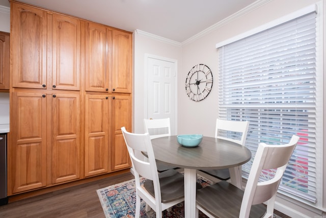 dining space featuring dark hardwood / wood-style flooring and crown molding