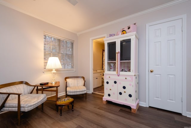 living area featuring dark hardwood / wood-style floors and ornamental molding