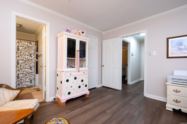 sitting room featuring dark hardwood / wood-style floors and ornamental molding