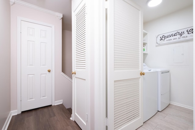 washroom featuring washer and clothes dryer and wood-type flooring