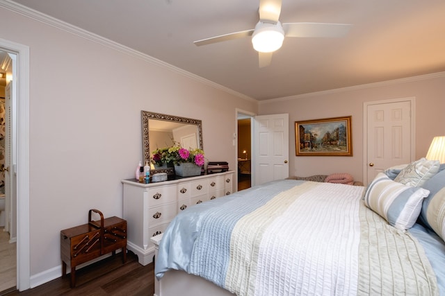 bedroom featuring ornamental molding, ceiling fan, and dark wood-type flooring