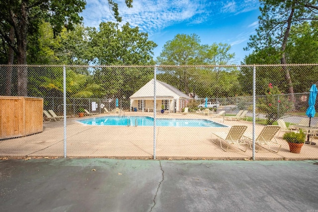 view of swimming pool with a patio area