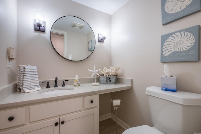 bathroom with vanity and toilet