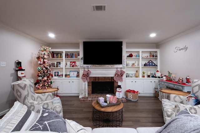 living room with a fireplace, crown molding, and dark wood-type flooring