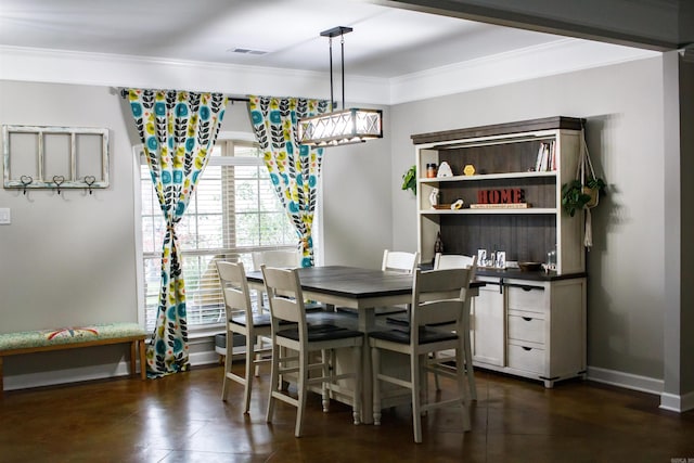 dining area with crown molding