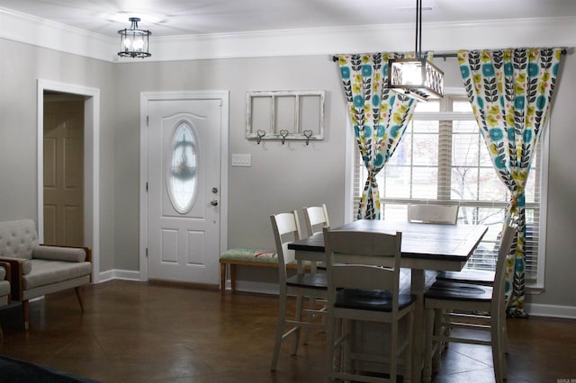 dining room featuring crown molding