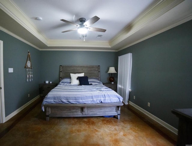 carpeted bedroom featuring a tray ceiling, ceiling fan, and crown molding