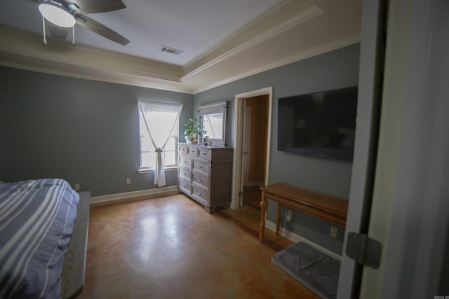 bedroom featuring a tray ceiling, ceiling fan, and ornamental molding