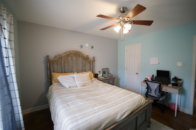 bedroom featuring ceiling fan and dark wood-type flooring