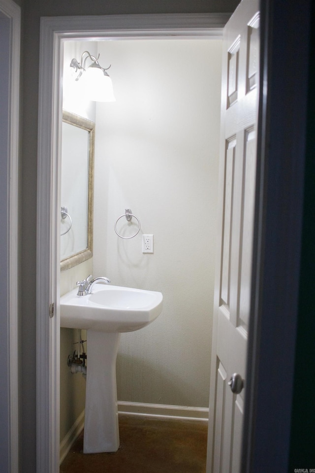 bathroom with hardwood / wood-style floors