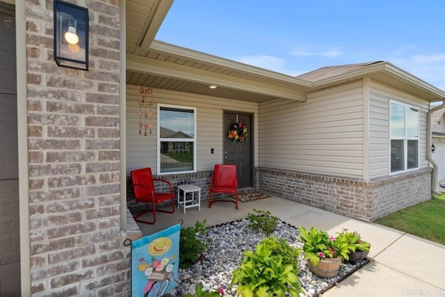 view of exterior entry featuring a porch