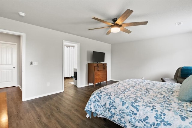 bedroom featuring ceiling fan and dark wood-type flooring