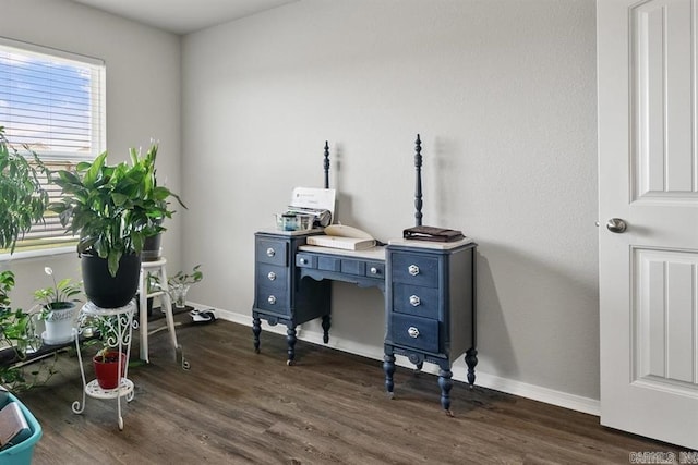 home office with dark hardwood / wood-style flooring