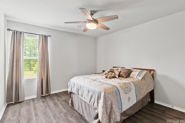 bedroom featuring ceiling fan and hardwood / wood-style flooring