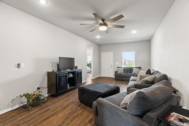 living room with dark hardwood / wood-style floors and ceiling fan