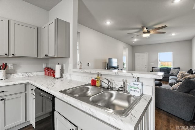 kitchen featuring kitchen peninsula, sink, dishwasher, gray cabinets, and dark hardwood / wood-style floors