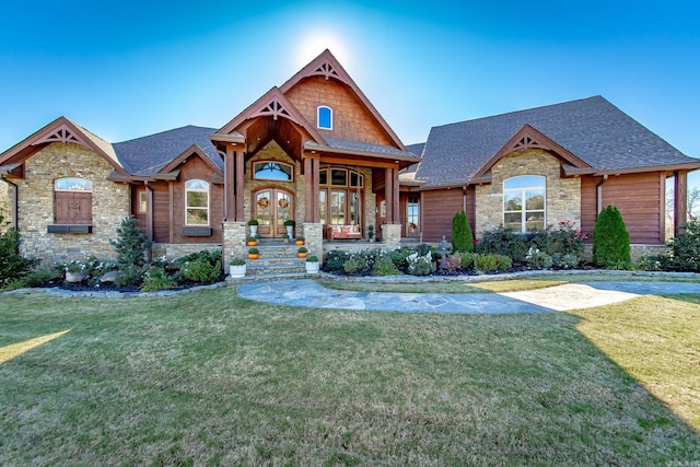 craftsman-style home featuring a porch and a front yard