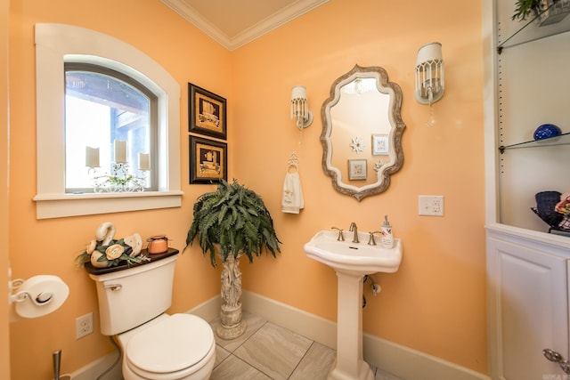 bathroom featuring tile patterned floors, toilet, and ornamental molding