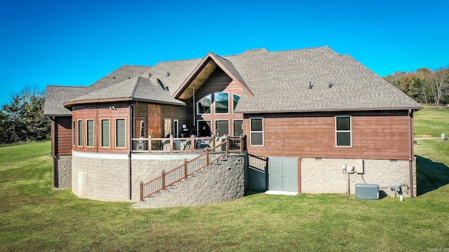 back of house with a lawn and a wooden deck