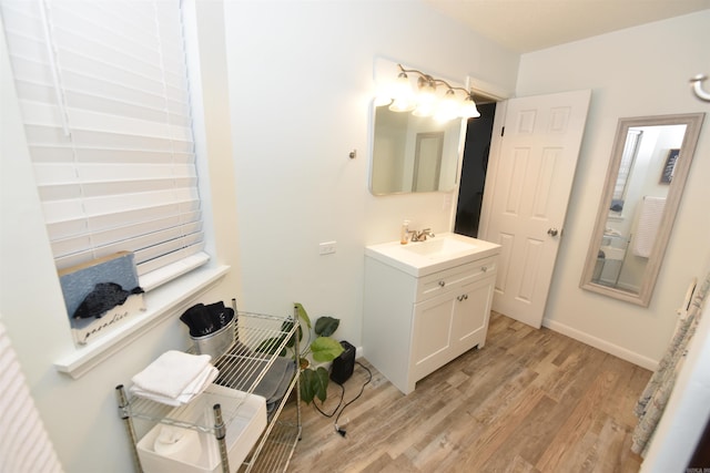 bathroom featuring hardwood / wood-style floors and vanity