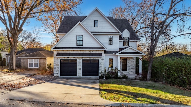 view of front of house featuring a garage and a front yard