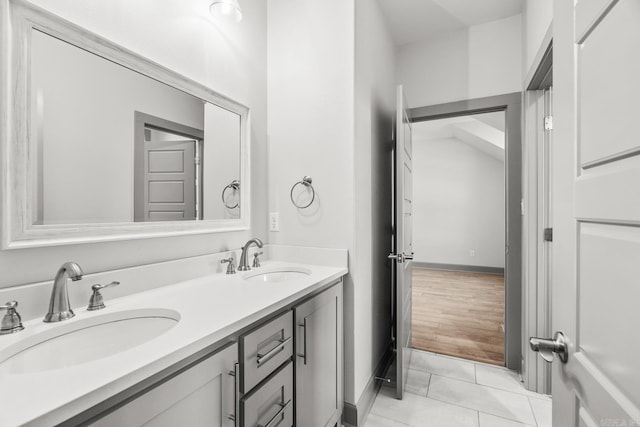 bathroom with tile patterned floors and vanity