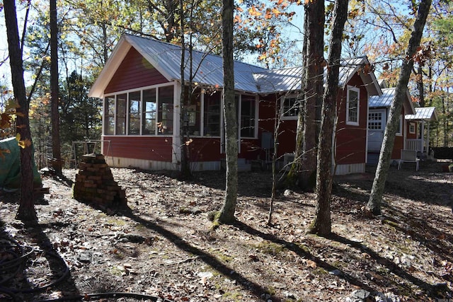 view of front facade featuring a sunroom