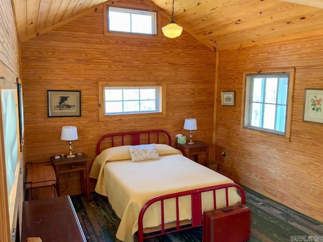 bedroom with multiple windows, wood walls, wooden ceiling, and wood-type flooring