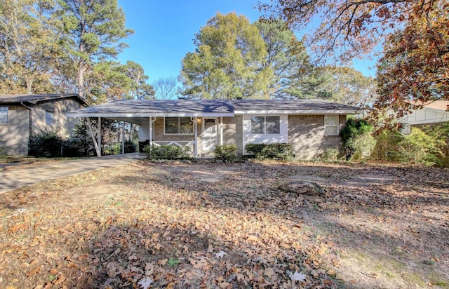 ranch-style house featuring a carport