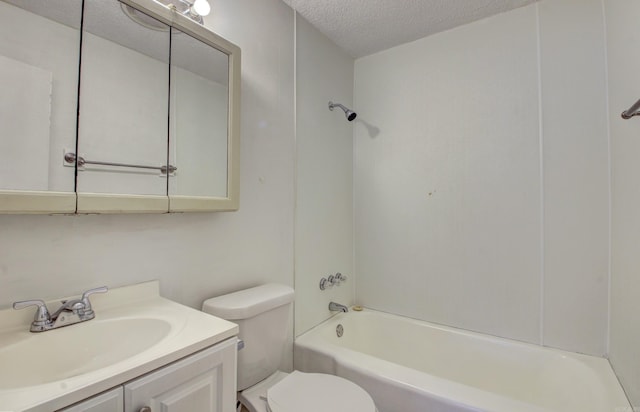 full bathroom with washtub / shower combination, vanity, a textured ceiling, and toilet