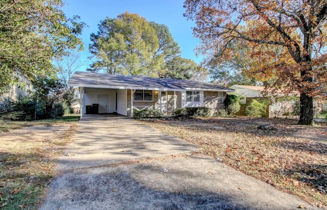 ranch-style house with a carport