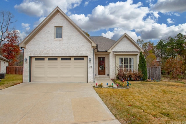 view of front of home with a garage and a front yard